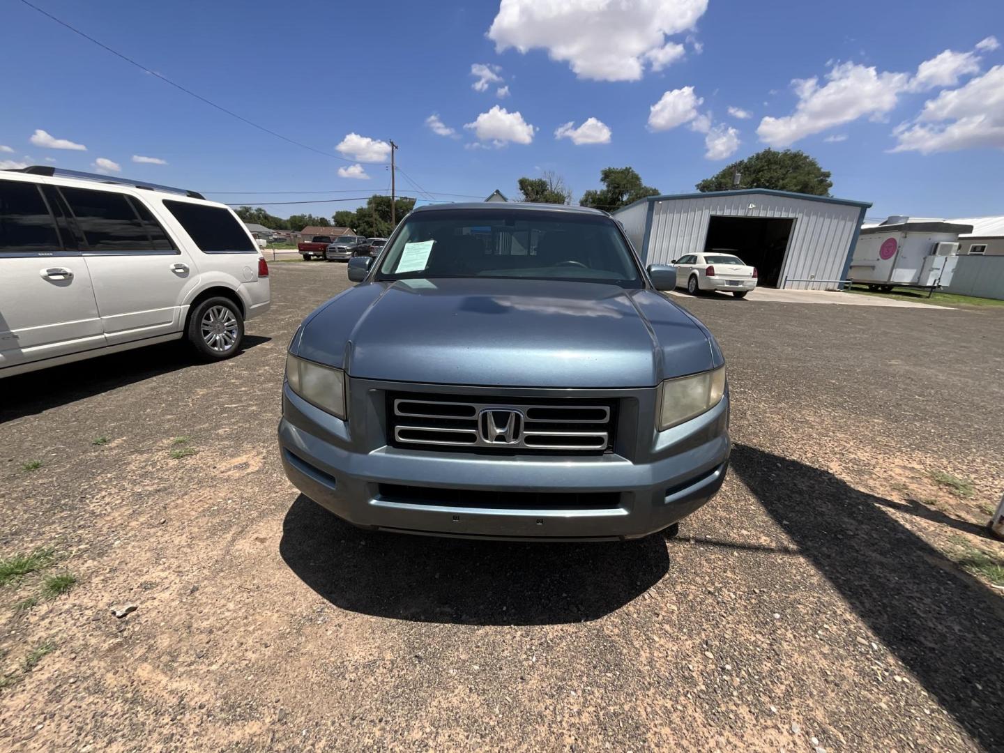 2006 Blue Honda Ridgeline RTL (2HJYK16536H) with an 3.5L V6 SOHC 24V engine, 5-Speed Automatic Overdrive transmission, located at 821 N. Prince Street, Clovis, NM, 88101, (575) 762-8852, 34.406643, -103.195999 - Photo#1