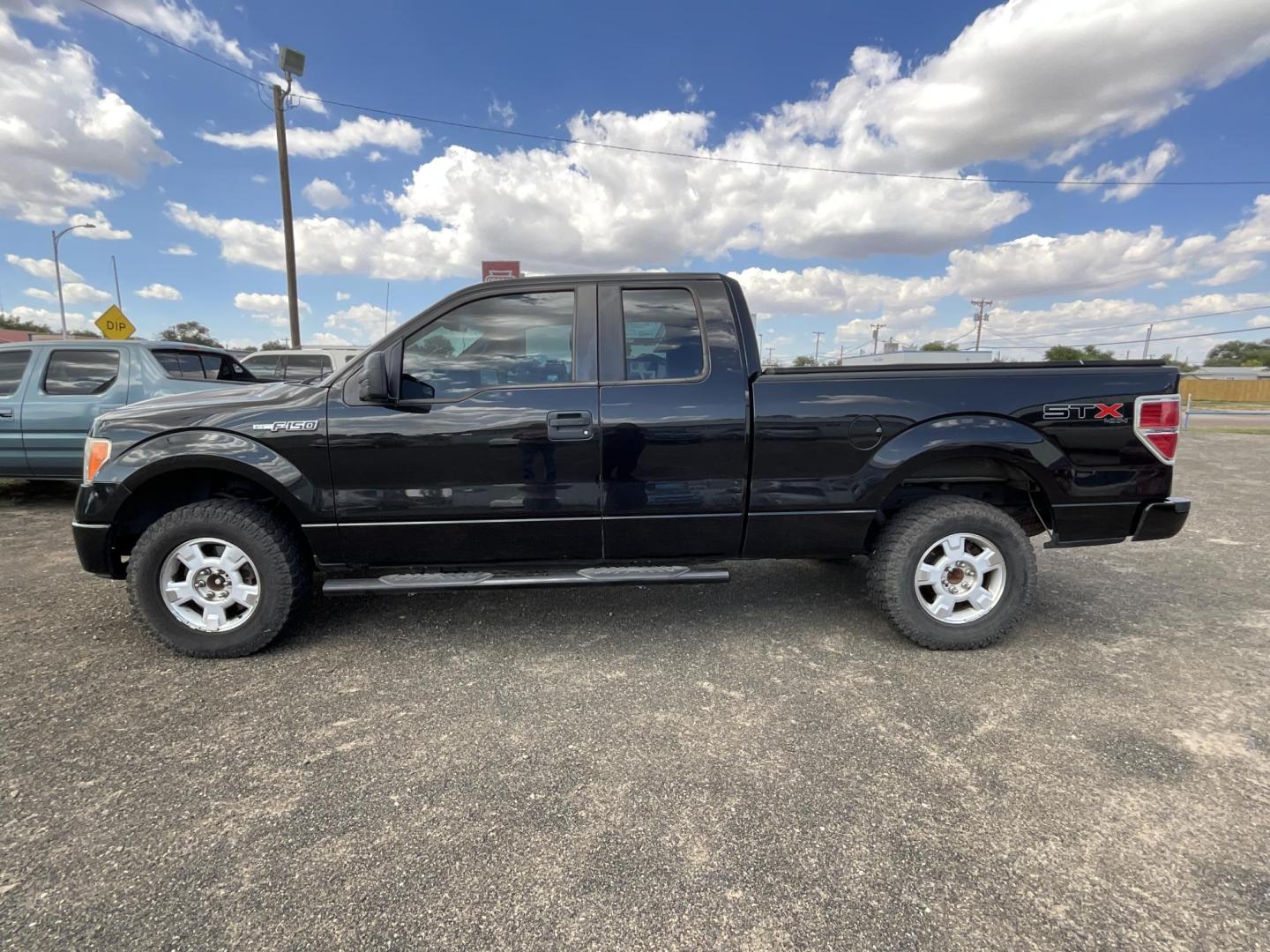 2013 Black Ford F-150 Lariat SuperCab 6.5-ft. Bed 4WD (1FTFX1EF5DK) with an 5.0L V8 engine, 6-Speed Automatic transmission, located at 821 N. Prince Street, Clovis, NM, 88101, (575) 762-8852, 34.406643, -103.195999 - Photo#0